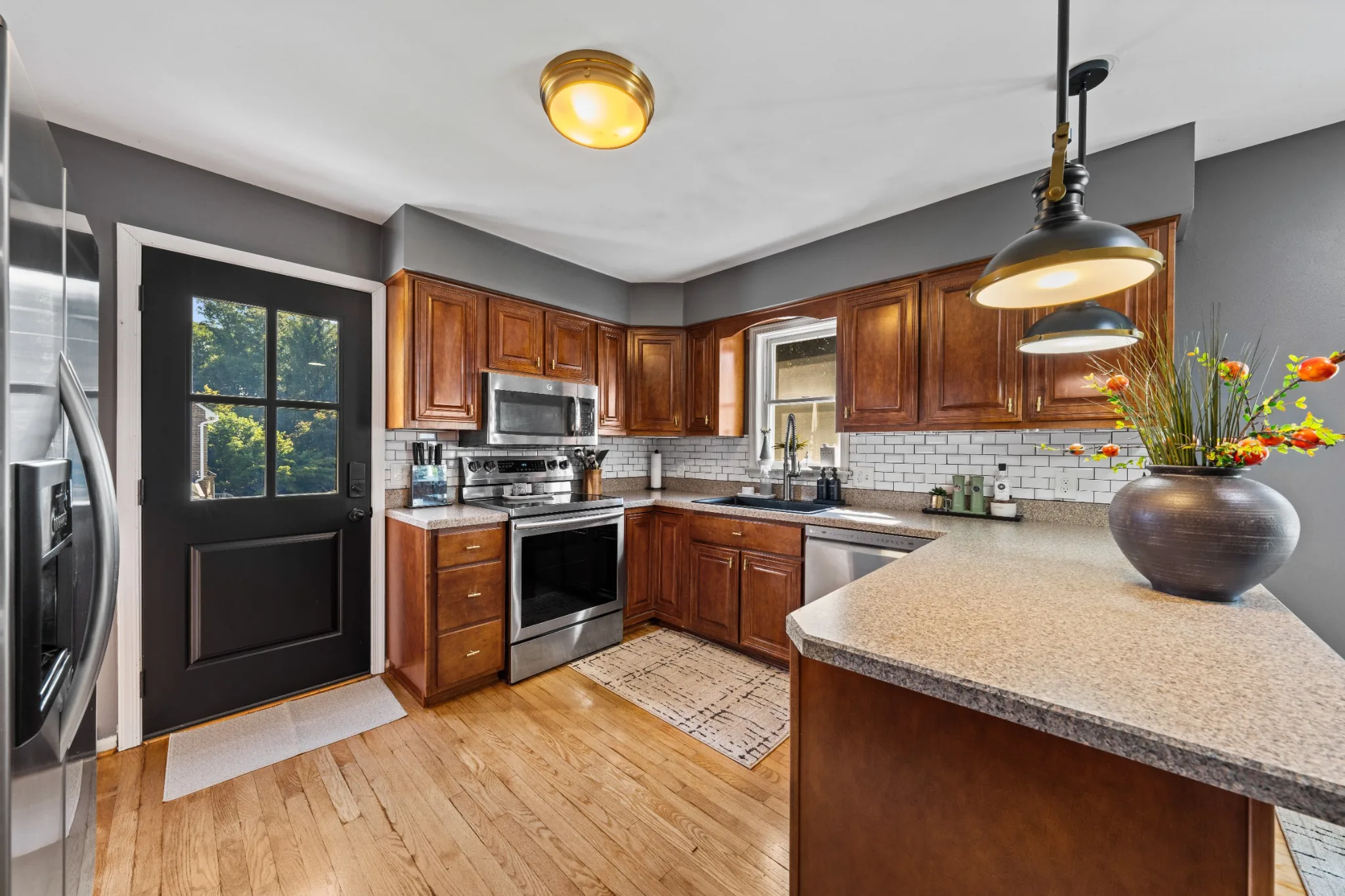 Kitchen with wood cabinetry and a center island