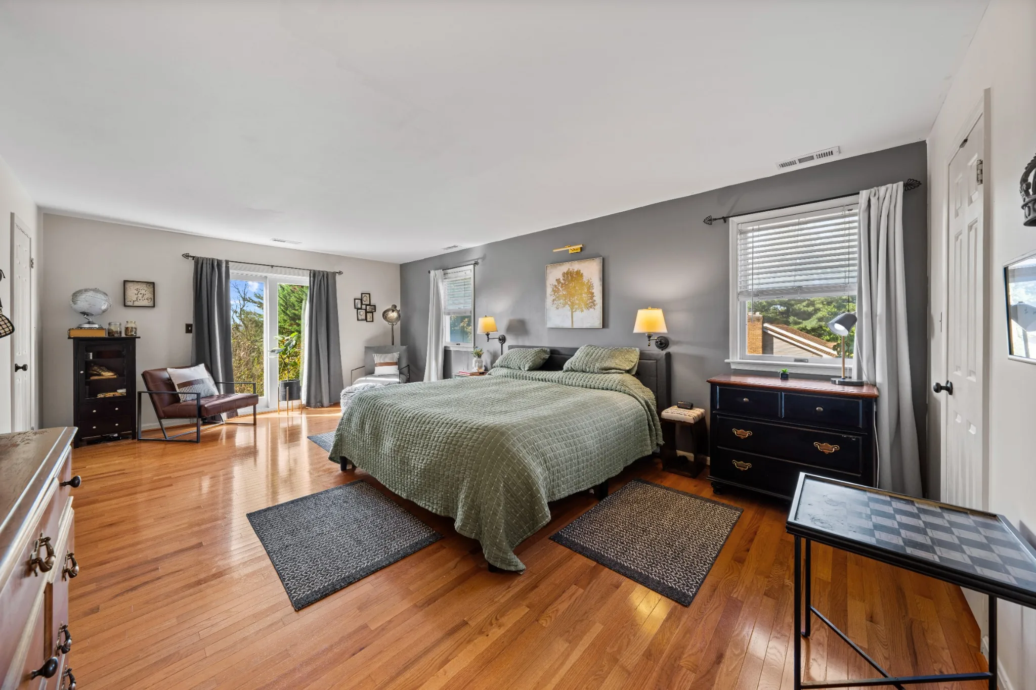 Bedroom with hardwood floors and windows