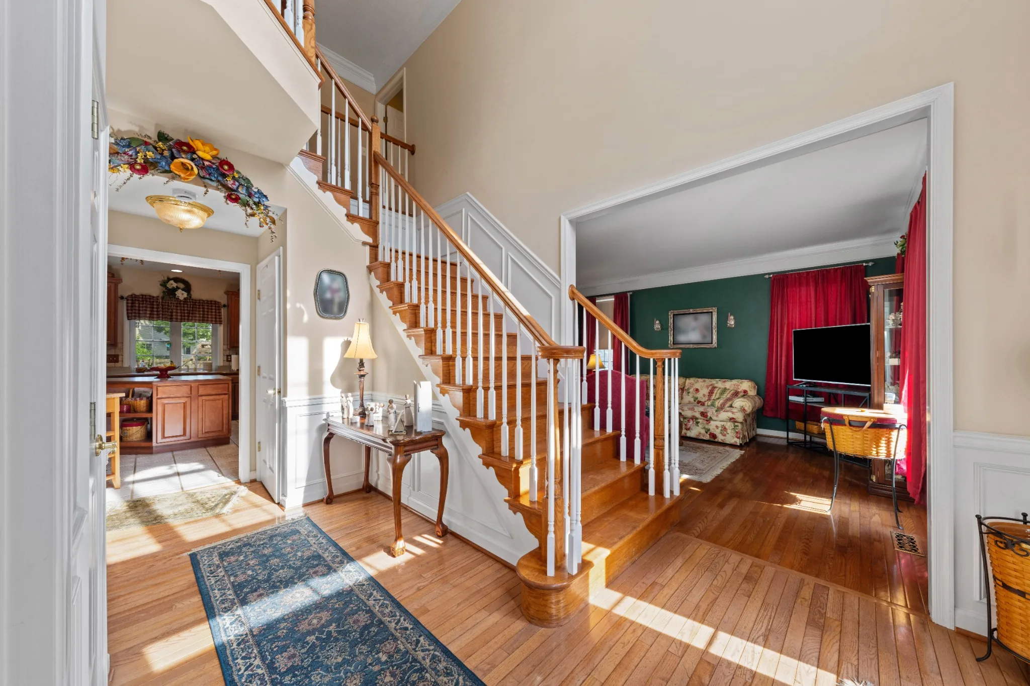 Two-story entry hall with a wood staircase